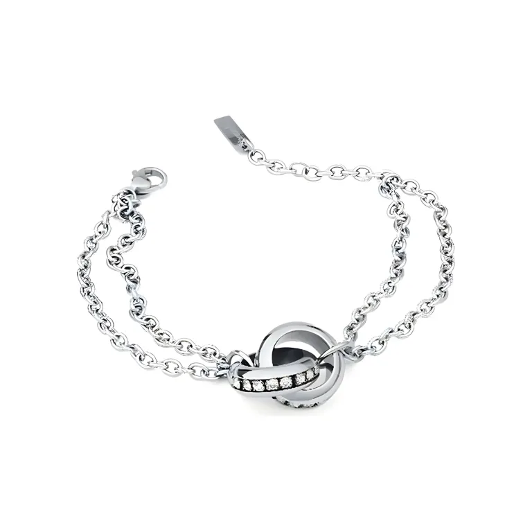 Silver bracelet featuring intertwined loops and a sparkling band of gems, showcasing elegance and modern design.